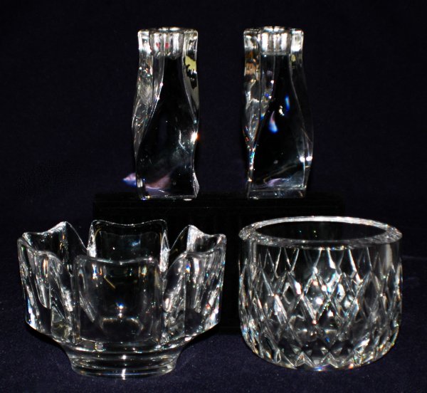 FOUR ORREFORS CRYSTAL TABLE ARTICLES: FOUR ORREFORS CRYSTAL TABLE ARTICLES Swedish. Signed. Comprising: pair of candlesticks and two bowls. Height of candlesticks 5 1/8". Diameter of bowl 5 3/4" and 4 3/4". (100/150)
