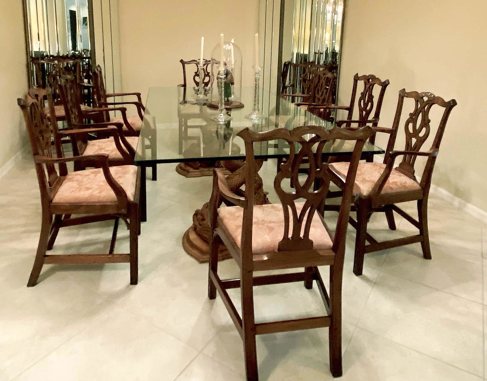 SET OF TEN GEORGE III STYLE MAHOGANY ARMCHAIRS: In the manner of Thomas Chippendale. Each with a scroll-carved crest over an open back with an interlaced splat, the curved arms centering a drop-in seat, on fret-carved legs joined by similarly carve