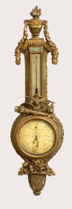 LOUIS XV CARVED AND GILTWOOD THERMOMETER/BAROMETER: French. Dated 1763. Maker: Gaffu a Paris. The case surmounted by an urn and swags, applied with doves and torch in relief above the barometer. Height 43". (Cond: chips, repainted, dial cracked and gla