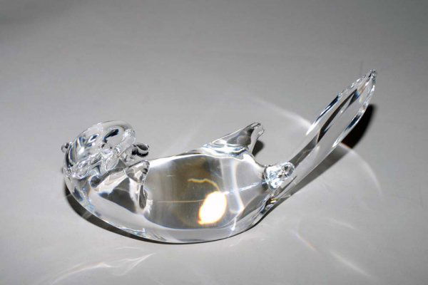 STEUBEN CRYSTAL "SEA OTTER": American. Signed. Designed by James Houston in 1978. Cat. No. 8368. Length 8 1/2".