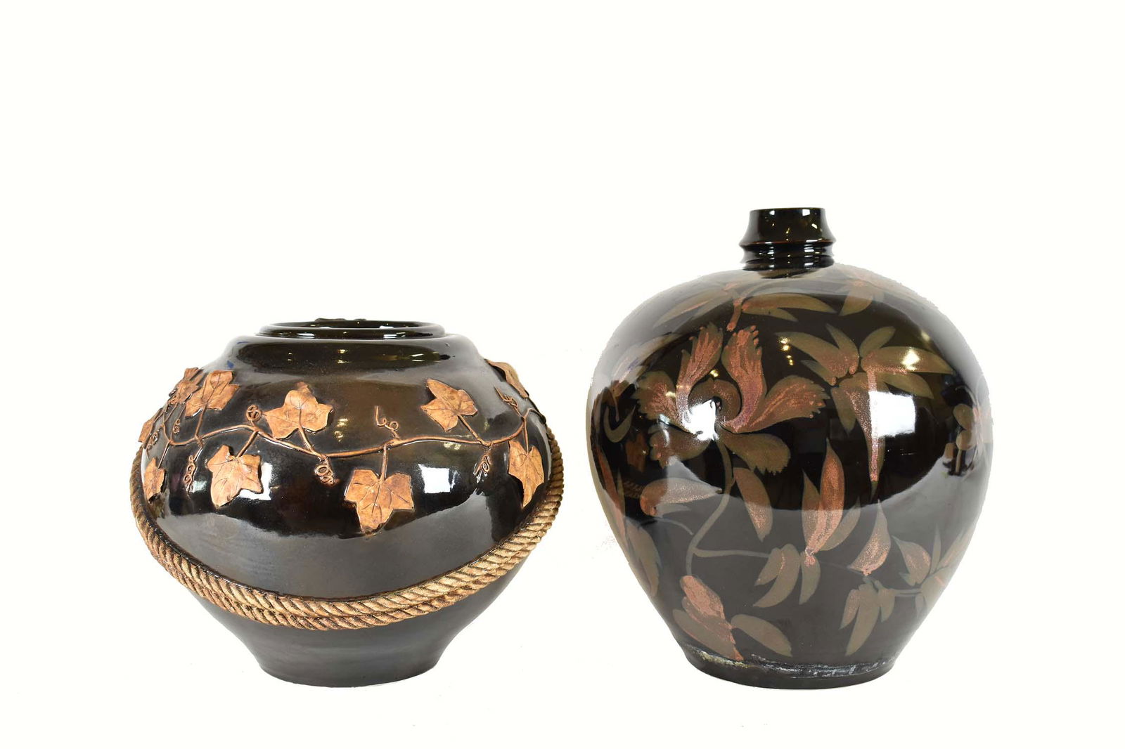 TWO LARGE FOLIATE DECORTATED BROWN GLAZED VASES (1 of 6)