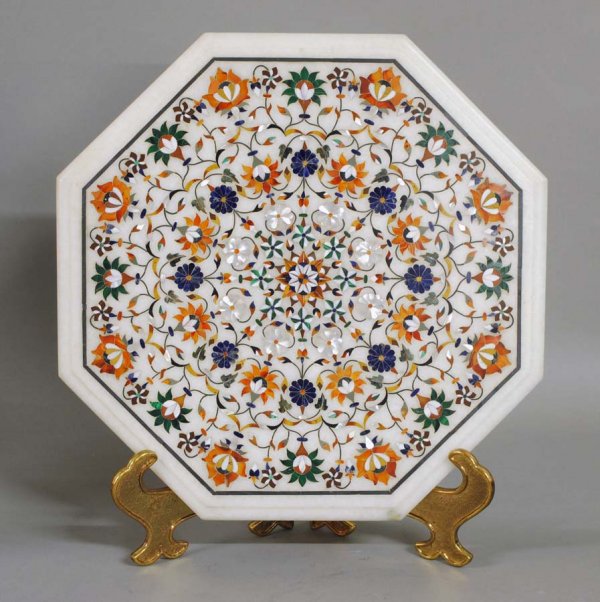INLAID MARBLE TABLE TOP: Indian. Of octagonal shape, inlaid with various hardstones including lapis lazuli, malachite, agate, carnelian and mother-of-pearl. Diameter 15 1/8". (600/800)