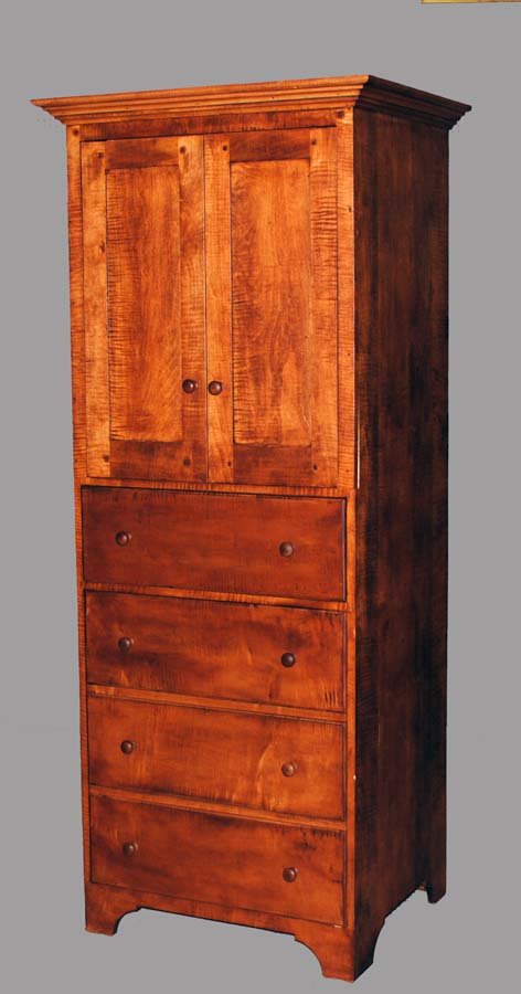 MAPLE SIDE CABINET: With molded pediment above a pair of cupboard doors, fall front and a door with faux drawer design, raised on bracket feet. Height 78". Width 32 1/2". Diameter 26". (150/200)