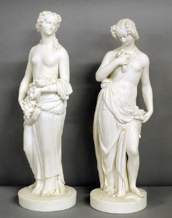 PAIR OF PARIEN-WARE FIGURES: English. Circa 1900. Each modeled as a semi-nude, one holding flowers, the other fruit. Height 14 1/4". (Cond: one base with age crack) (300/500)