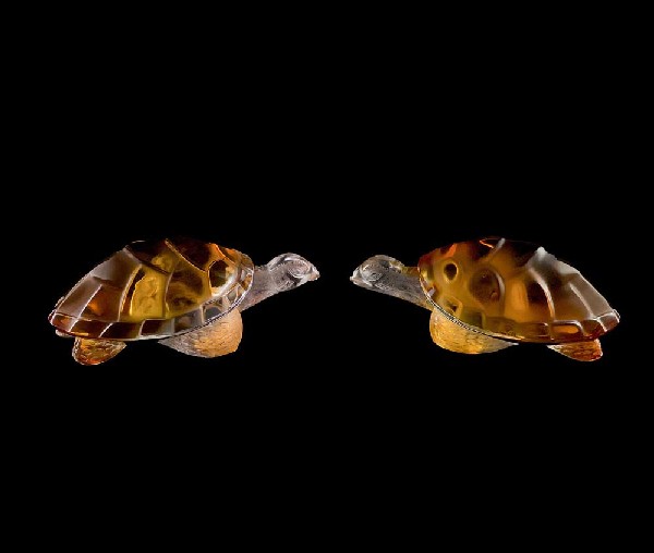 TWO LALIQUE AMBER CRYSTAL "CAROLINE" TURTLES: French. Signed Lalique France. Catalog No. 11639. Length 5 ¾". (400/500)