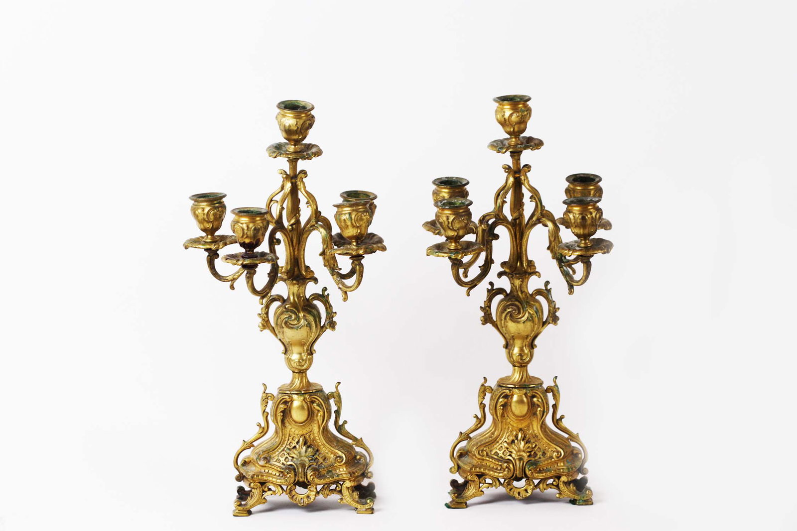 PAIR OF LOUIS XV STYLE GILT BRONZE CANDELABRA: Early 20th Century. Of Rococo design, the candelabra with four scrolled arms centering a single nozzle. Height 15.5 in. Width 7 in. (Cond: one nozzle loose)
