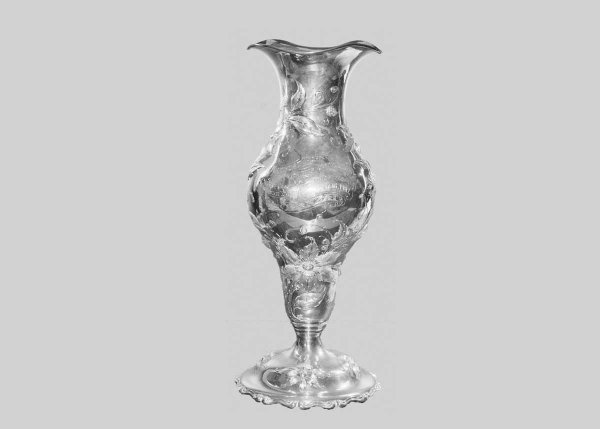 VERY FINE STERLING SILVER YACHTING TROPHY: American.1876-1907. Maker: Black, Starr & Frost. Extensively chased with foliage. Engraved "Newport Yacht Racing Association Race for New York Yacht Club Thirty Footers, August 16, 1907 Won by Banzai"