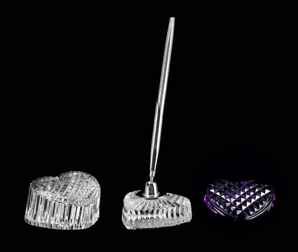 GROUP OF THREE WATERFORD CRYSTAL TABLE ARTICLES: Irish. Comprising: a heart shaped paperweight, a heart shaped pen holder and an amethyst heart. (100/150)