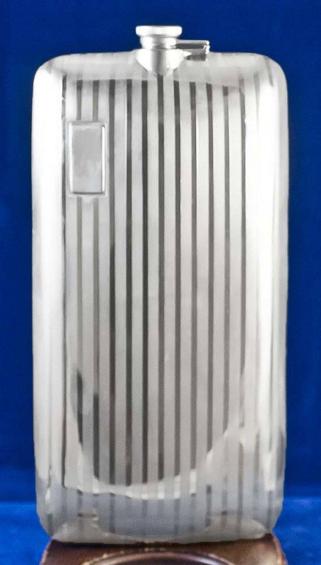 STERLING SILVER FLASK: American. 1909-1935. Maker: Clarence A. Vanderbilt. With geometric design. Height 10 1/4". (12 oz) (300/400)