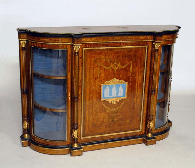 NAPOLEON III GILT BRZ MNTD & BURL AMBOYNA CREDENZA: French. 19th Century. The D-shaped top above a central cupboard door inlaid with swags and foliage, mounted with a blue and white jasper plaque, flanked by reeded columns and two glazed doors. Height