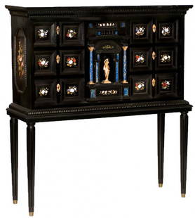 MARBLE AND LAPIS INLAID EBONIZED CABINET ON STAND: Northern Italian. 19th Century. In two parts. The rectangular case with molded pediment above an arrangement of drawers inlaid with pietra-dura plaques, centered by a door with lapis columns containin