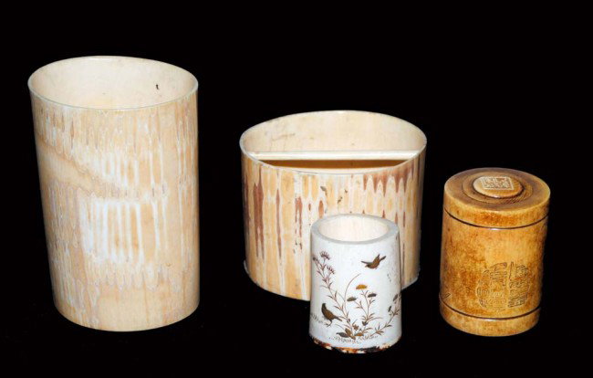 GROUP OF FOUR IVORY TABLE ARTICLES: Chinese/Japanese. Comprising: two brush pots, etched and stained ivory cylinder and a shibayama miniature tusk. (100/150) (NOTE: INTERNATIONAL SHIPPING IS NOT AVAILABLE FOR THIS ITEM; ITEM WAS LEGALLY