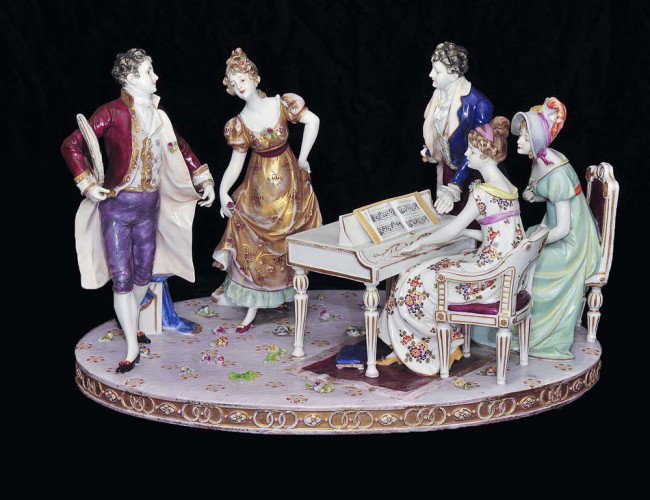 LARGE PORCELAIN FIGURAL GROUP: German. 1909-1939. By Wurttemberg Porc. Man. Of a group of men and ladies listening to a piano recital. Length 17 1/4". (400/600)