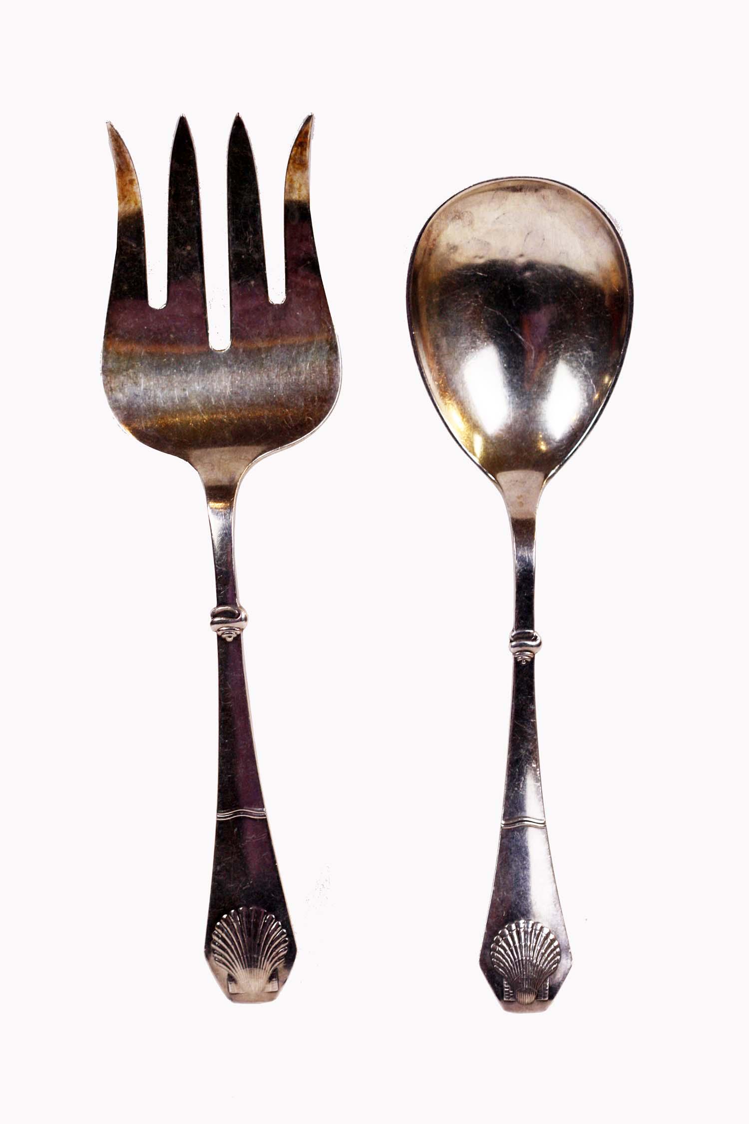 PAIR OF DANISH W.S. SORENSEN STERLING SALAD SERVERS: W.S. Sorensen. The handles chased with a scalloped shell. Length 9.25 in. 4.8 Troy oz.