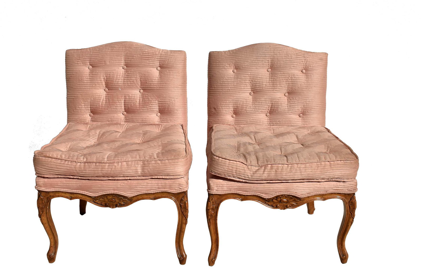 PAIR OF LOUIS XV STYLE BEECHWOOD SLIPPER CHAIRS: First half 20th Century. The button-tufted upholstered backs and seats above a shaped skirt on cabriole legs carved with foliage and scrolls. Height of back to floor 32 in., seat to floor 18 in. Width