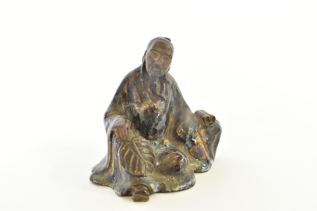 JAPANESE SUMIDA GAWA POTTERY FIGURE: Edo/Meiji Period. Depicting a seated scholar. Height 5.5 in. Width 6 in. Depth 4.5 in. (Cond: good)