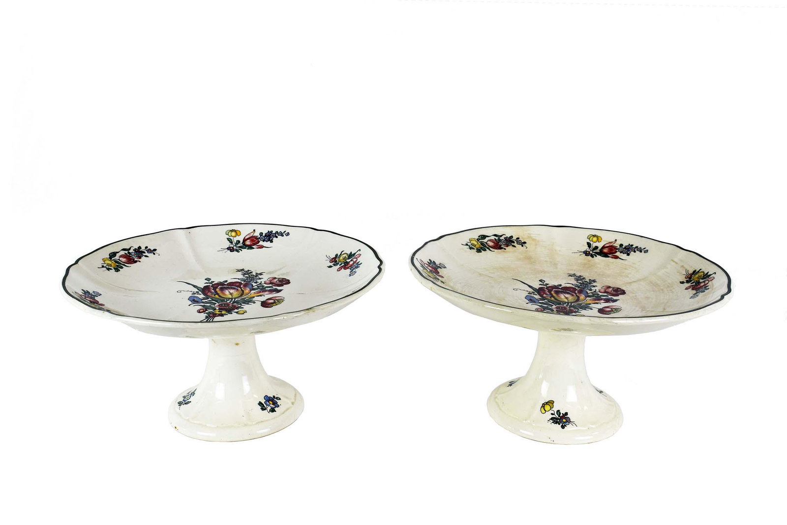 PAIR OF VILLEROY & BOCH EARTHENWARE TAZZAS: Late 19th/Early 20th Century. Marked, in the Old Strawberry pattern. Height 6.6 in. Diameter 10.5 in. (Condition: One Tazza with heavy crazing to surface)