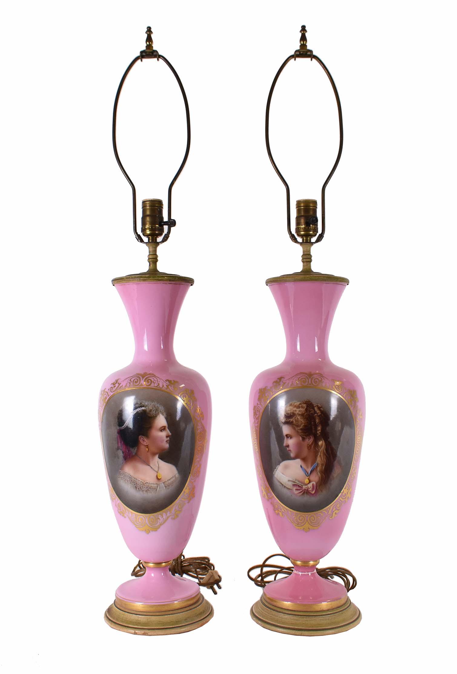 PAIR OF FRENCH PINK OPALINE VASES/LAMPS: Circa 1870. Now mounted as lamps. Each vase form vessel decorated with an elegant female portrait, the reverse with a floral bouquet. Electyrified. Height 29 in. Diameter at shoulder 7 in. (Cond: dril