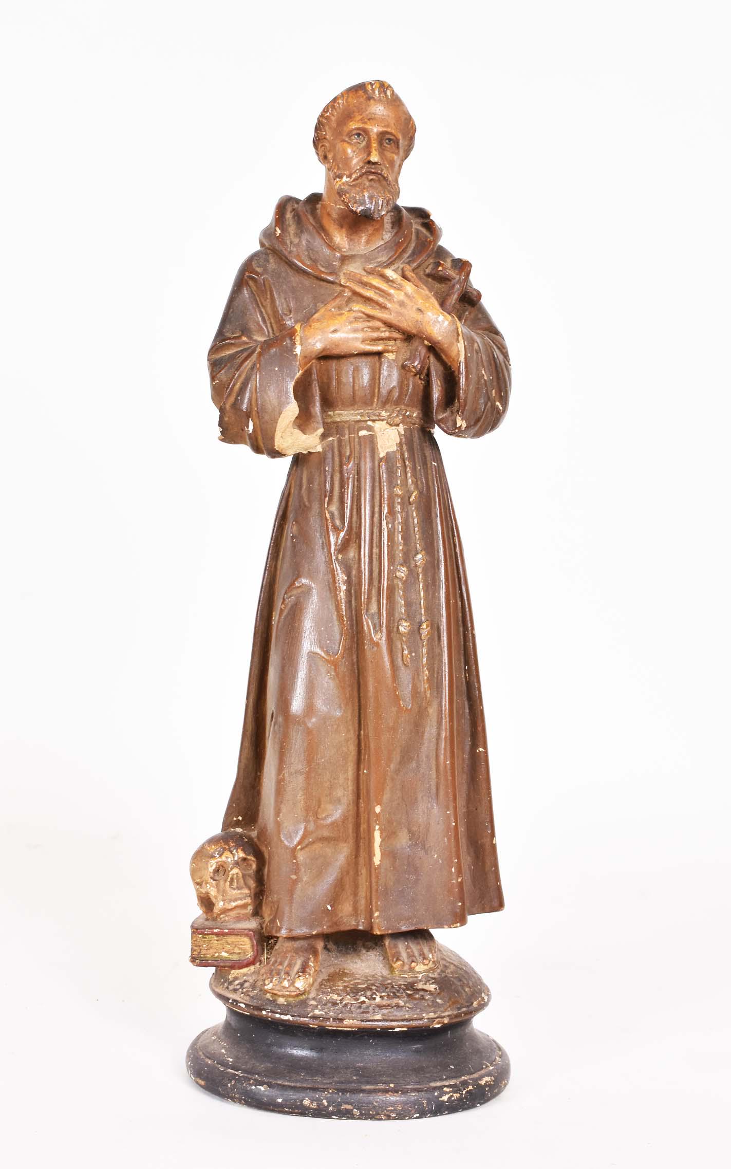 PAINTED PLASTER FIGURE OF A MALE SAINT: 20th Century. Probably St. Francis of Assisi. Height 17 in. (Cond: minor losses) cf. although usually associated with birds and other animals, St. Francis is frequently shown with a skull and book at 