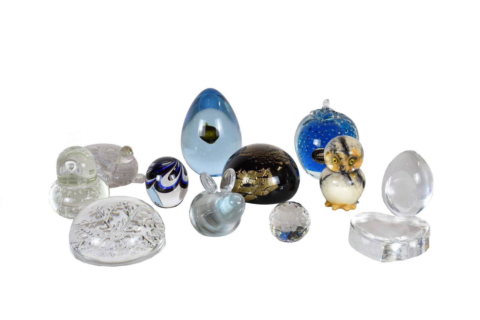 ELEVEN VARIOUS GLASS PAPERWEIGHTS: Including Italian/Venetian examples, a black with gold flecks, a snowflake, two egg shaped examples, and a turtle-shaped weight together mineral owl figure (12 pcs) Sizes vary.