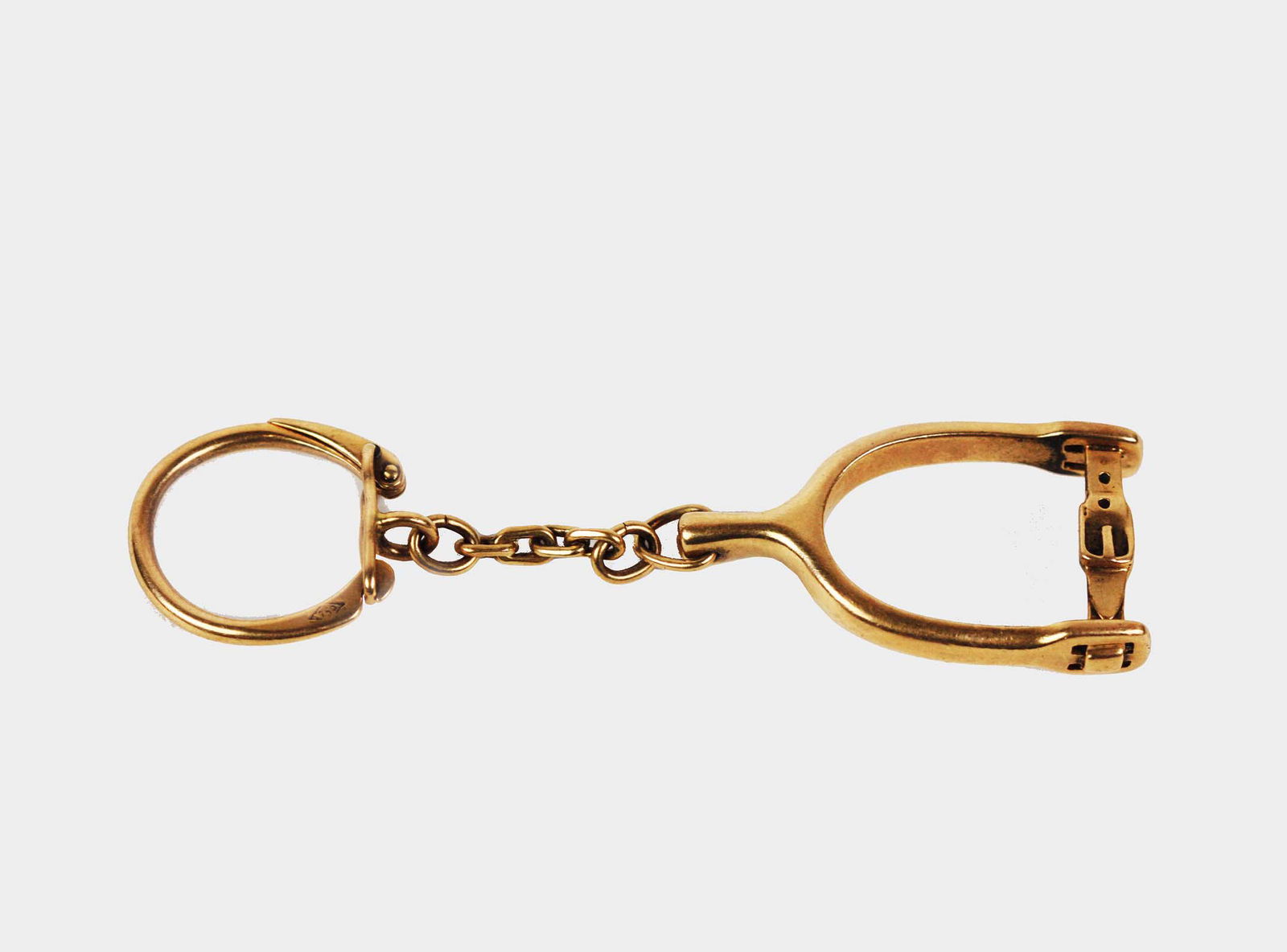 GUCCI ITALY 18KT. YELLOW GOLD STIRRUP KEYCHAIN: Stamped Gucci 750 Italy. 3 3/4 in length. 3/4 in. wide. 16.71 dwt.