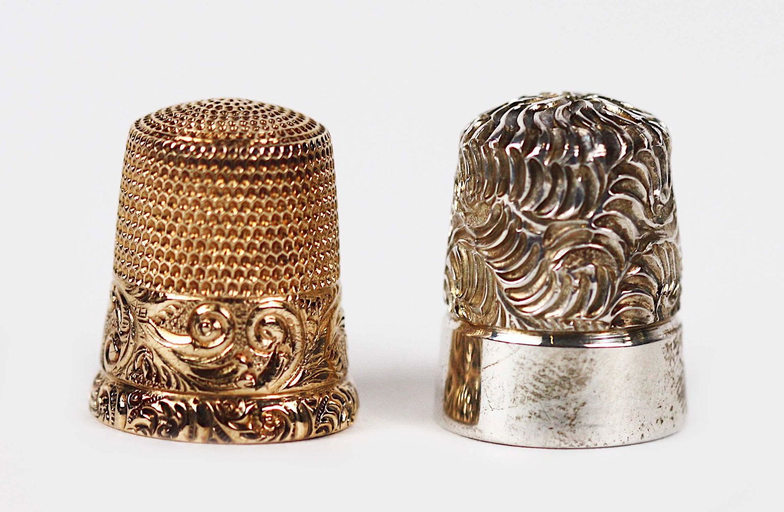 ANTIQUE 10KT. GOLD THIMBLE: Together with a silver thimble. Marked 9. Gold Thimble tests for 10KT.