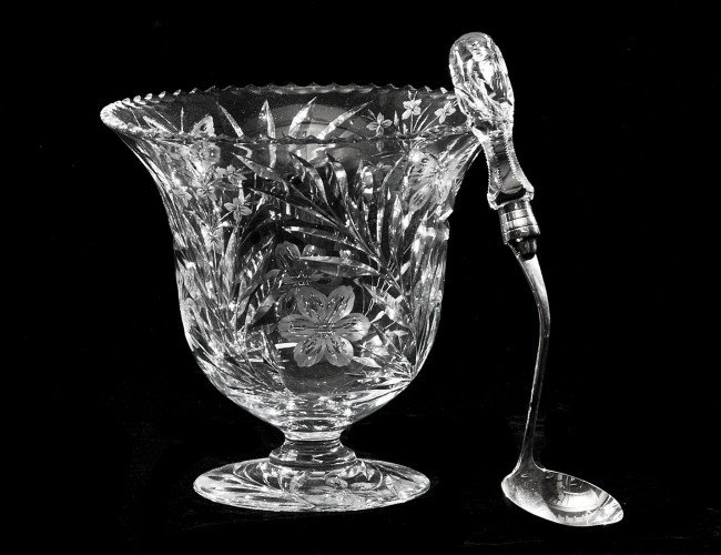 UNSIGNED PAIRPOINT CUT GLASS PUNCH BOWL AND LADLE: American. 20th Century. Ladle with silver plated bowl and lower handle stamped Pairpoint. Height 8 3/4". Diameter 9 1/4". (300/400)
