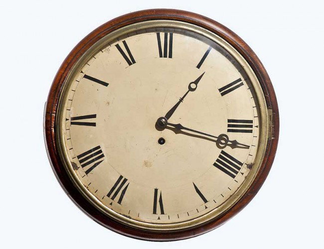MAHOGANY WALL CLOCK: German. 20th Century. With circular enameled dial painted with Roman numerals, fitted with Fusee movement. Diameter 14". (300/400)