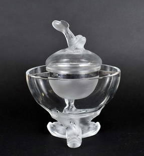 LALIQUE COLORLESS GLASS IGOR CAVIAR BOWL: Etched Lalique signature in script. The outer circular bowl on frosted tripod sturgeon-head feet, the smaller interior covered bowl with a frosted fish finial/handle. Height 9.5 in. Diameter 7.5 in.