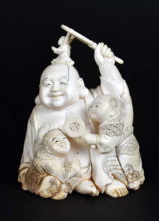 JAPANESE OKIMONO OF HOTAI AND BOYS: Signed on the underside. The boys climbing over a seated Ho, atop him while he joyfully fans himself. Height 4 in. Width 3 in.