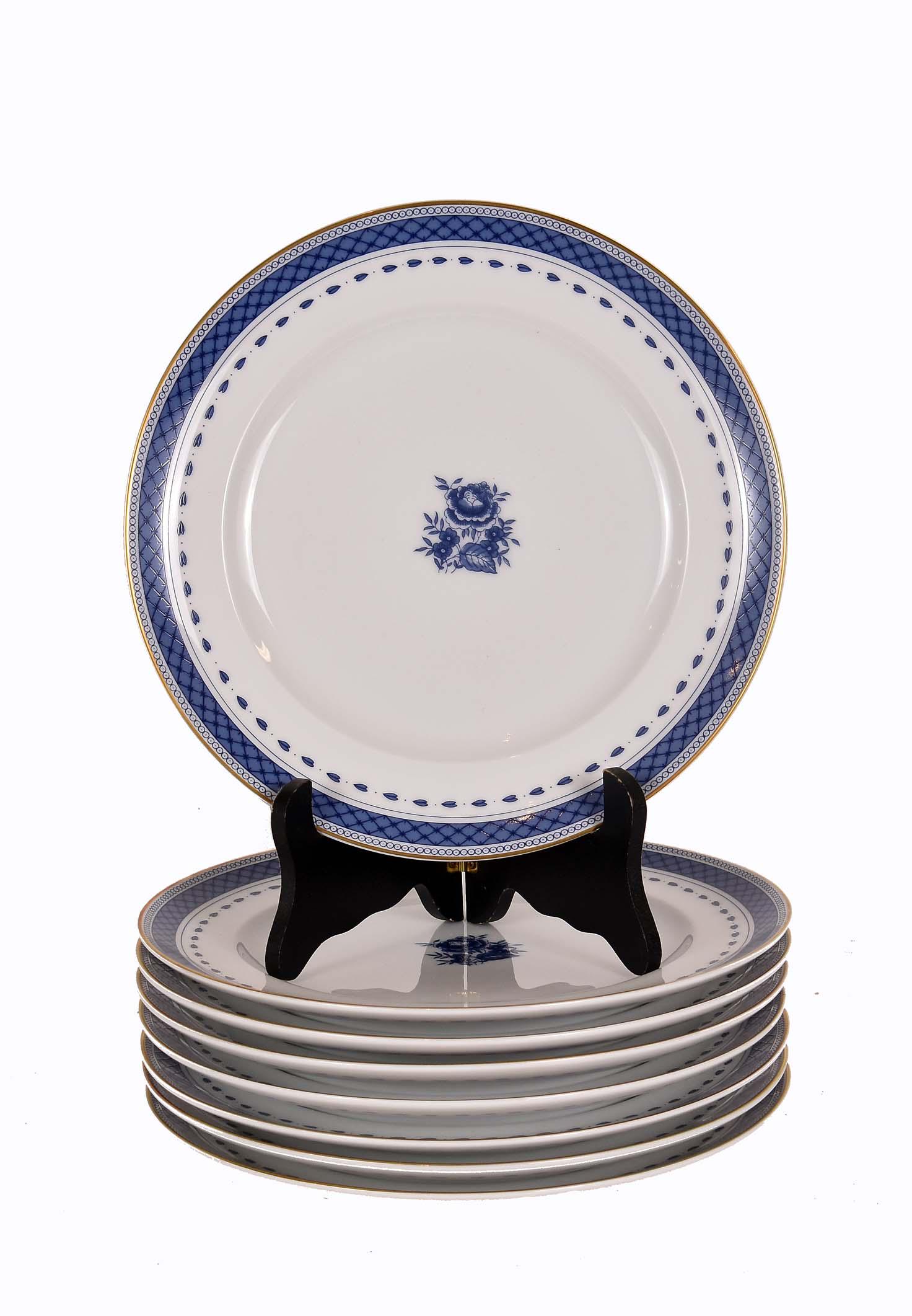 EIGHT MOTTAHEDEH CHINESE-EXPORT PORCELAIN PLATES: The underside of each marked. The center recess with a blue floral sprig, with multiple blue borders. Diameter 8.5 in.