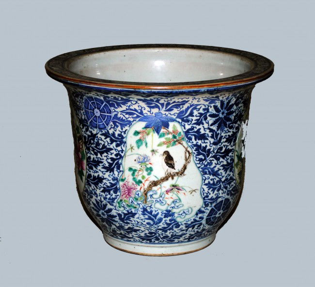 FAMILLE ROSE PORCELAIN JARDINIERE: Chinese. 19th Century. Painted with bird panels on a blue and white ground. Diameter 16 1/2". (600/800) NOTE: This lot is being re-offered for sale due to the fact that Mr. Peng Zhao of Beijing, China