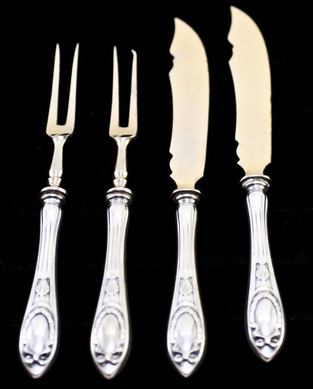 TWELVE PIECE CONTINENTAL SILVER FRUIT SERVICE: German. (.800 Fine) Comprising: six knives and six forks. Together with six silver and gilt fruit knives and six forks. (24 pcs) (100/150)