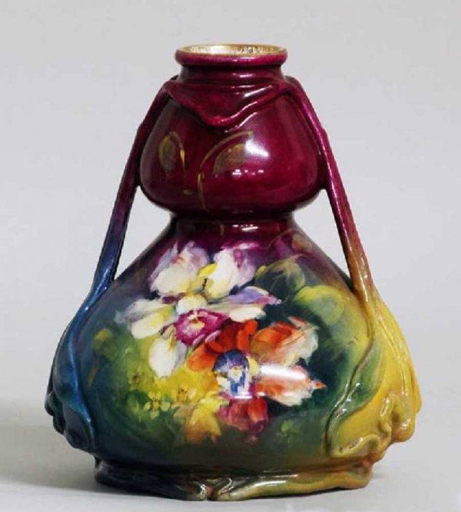 ROYAL BONN FAIENCE VASE: German. Circa 1930. Printed factory marks. Of double gourd shape with molded ribbon handles, painted with a multi-color flower motif. Height 8".