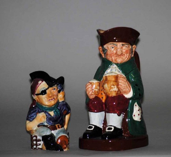 TWO PORCELAIN TOBY JUGS: English. The first by Royal Doulton, "Old Charlie", height 8 1/2". The second by Shorter "Long John Silver", height 5 1/4".