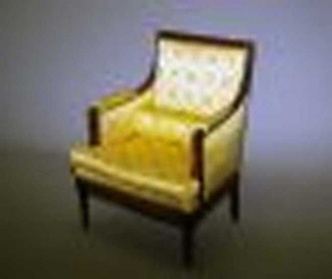 LOUIS XVI FRUITWOOD BERGERE: French. 18th Century. The rectangular backrest flanked by closed arms with balster supports, the seat with loose cushion raised on circular tapered legs.