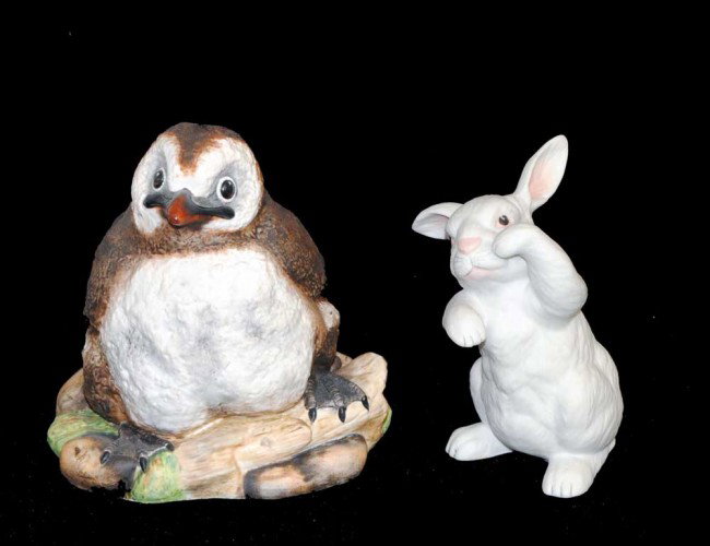 TWO BOEHM PORCELAIN FIGURES: Comprising a bunny and a penguin. Heights 4 1/4" and 5".