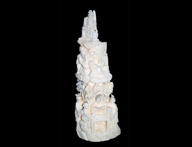 CARVED IVORY MOUNTAIN: Chinese. Of half tusk form depicting figures on various levels. Height 10 7/8". (300/400)