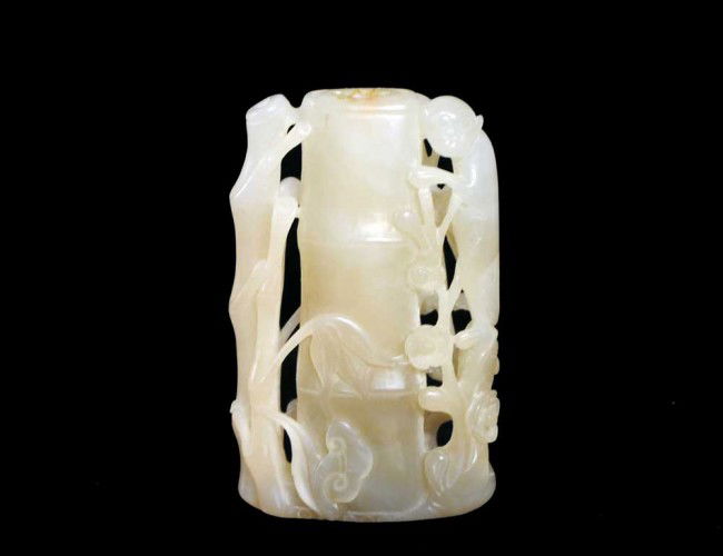 WHITE JADE SNUFF BOTTLE: Chinese. 19th Century. Well carved in the shape of a bamboo stalk flanked by a monkey and smaller bamboo stalks. Height 3". (Cond: no stopper or spoon) (1000/1500)