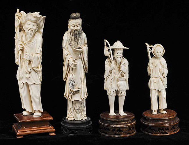 GROUP OF FOUR CARVED IVORY FIGURES: Oriental. Comprising: female farmer, height 6"; fisherman wearing straw jacket, height 6 3/8".; fisherman with a large leaf as a hat, height 9"; and a long bearded man holding a fish, height 9". All o