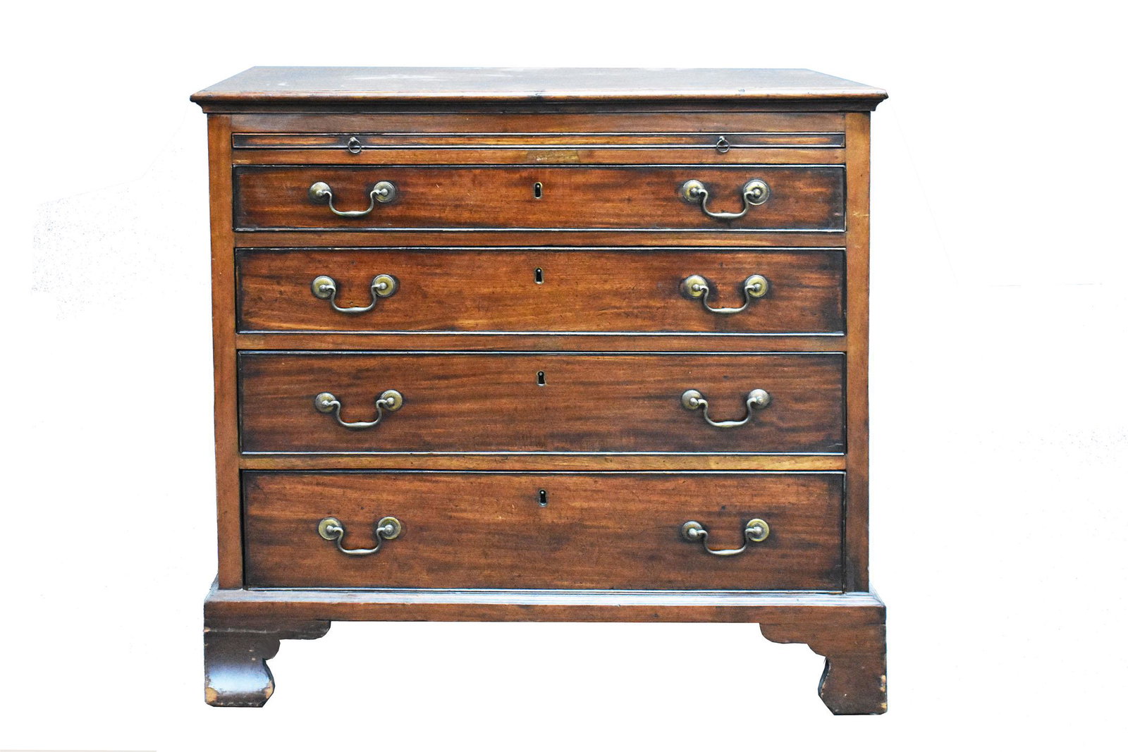 GEORGE III MAHOGANY CHEST OF DRAWERS: Late 18th Century. The rectangular molded top above a conforming case with a brushing slide over four cock-beaded drawers, on bracket feet. (Cond: repairs)