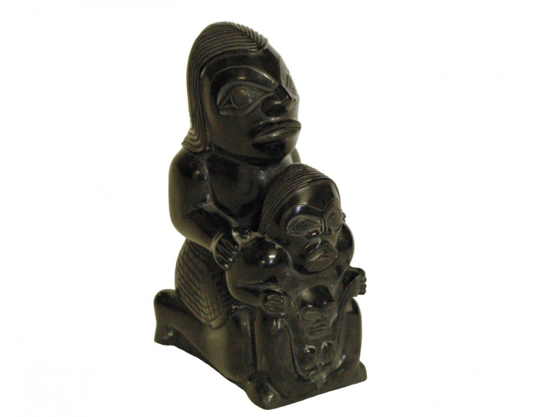 CARVED AND POLISHED ARGILLITE GROUP "VOLCANIC WOMA: Inuit. By Greg Lightbown. Signed. Height 6 3/8". Provenance: Marion Scott Gallery, Vancouver, BC, Canada. (400/600)