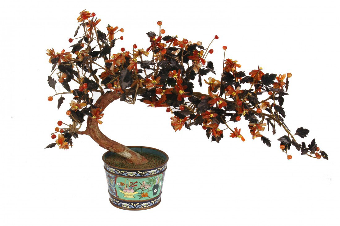 HARDSTONE TREE: Chinese. Composed of agate, chalcedony and serpentine jade leaves and flowers, contained in a cloisonne enamel jardiniere. Height 19 1/2". (600/800)