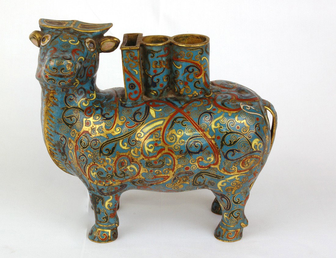 CLOISONNE ENAMEL OXEN VASE: Chinese. Standing four square with turned head, supporting a rectangular and two cylindrical vases. Height 6 3/4". (250/350)