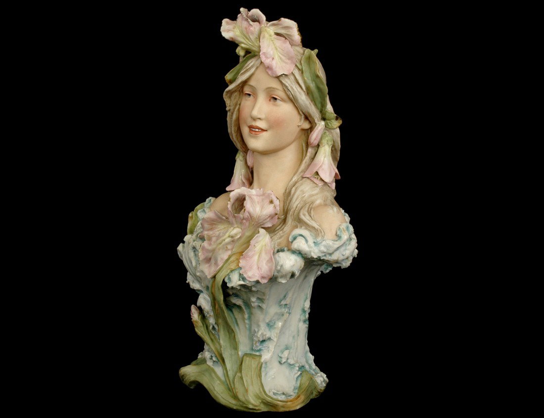 ROYAL DUX PORCELAIN BUST OF A MAIDEN: Bohemian. 20th Century. Pink embossed mark and number 633. Height 18". (Cond: losses to flowers) (500/700)