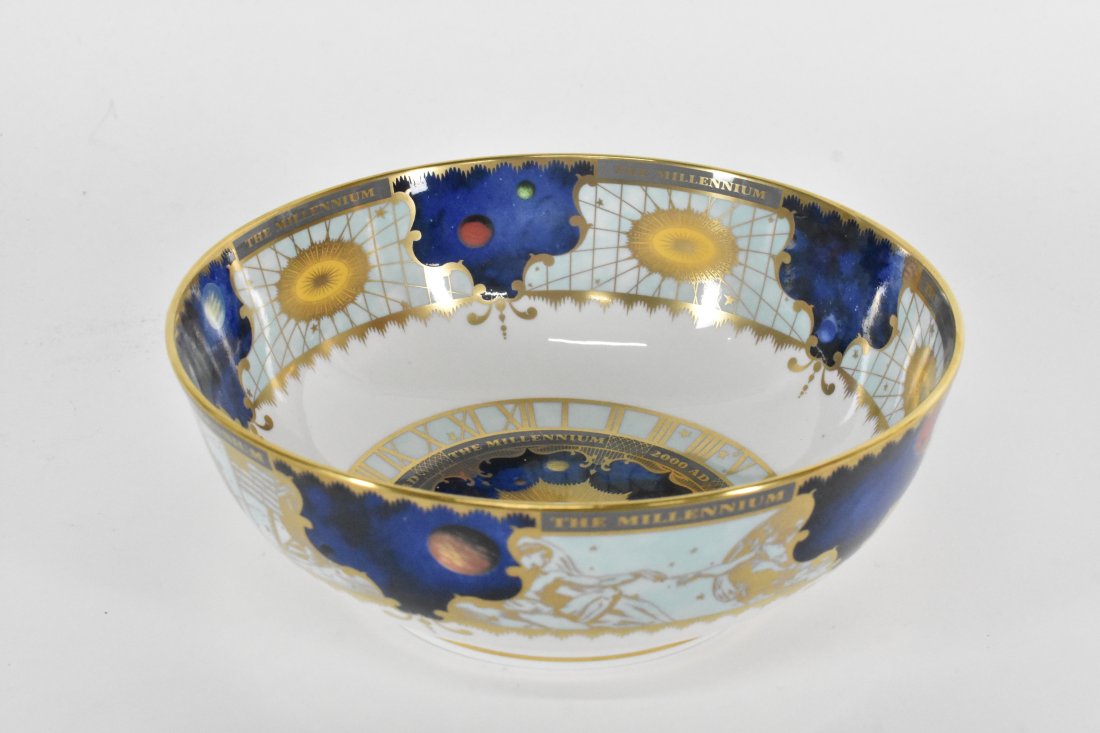 ROYAL WORCESTER MILLENNIUM 2000 PORCELAIN BOWL: The underside marked. Decorated in blue and gold with images representing the Arts and Sciences. Height 3.25 in. Diameter 9 in.
