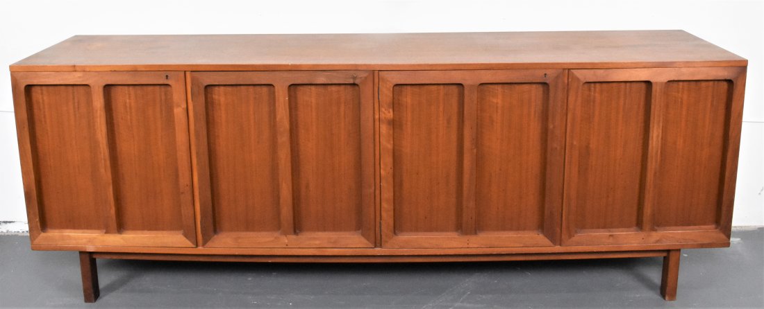 DANISH MODERN MAHOGANY SIDEBOARD: Circa 1970. Unmarked. The rectangular fitted with four divided doors, opening to slides with a three-quarter gallery and open shelves, on straight legs. Height 31.5 in. Width 86 in. Depth 19 in.