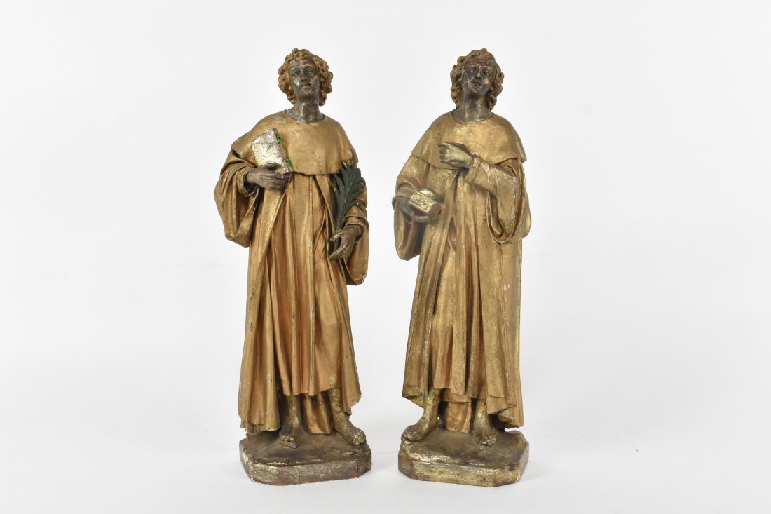 PAIR OF GILT PAPIER MACHE MALE FIGURES: European, early to mid-20th Century. Reputed to be connected to pharmaceuticals, perhaps allegories or saints, each in long robes and holding either a casket, a book and a palm frond. Height 14.25 in.