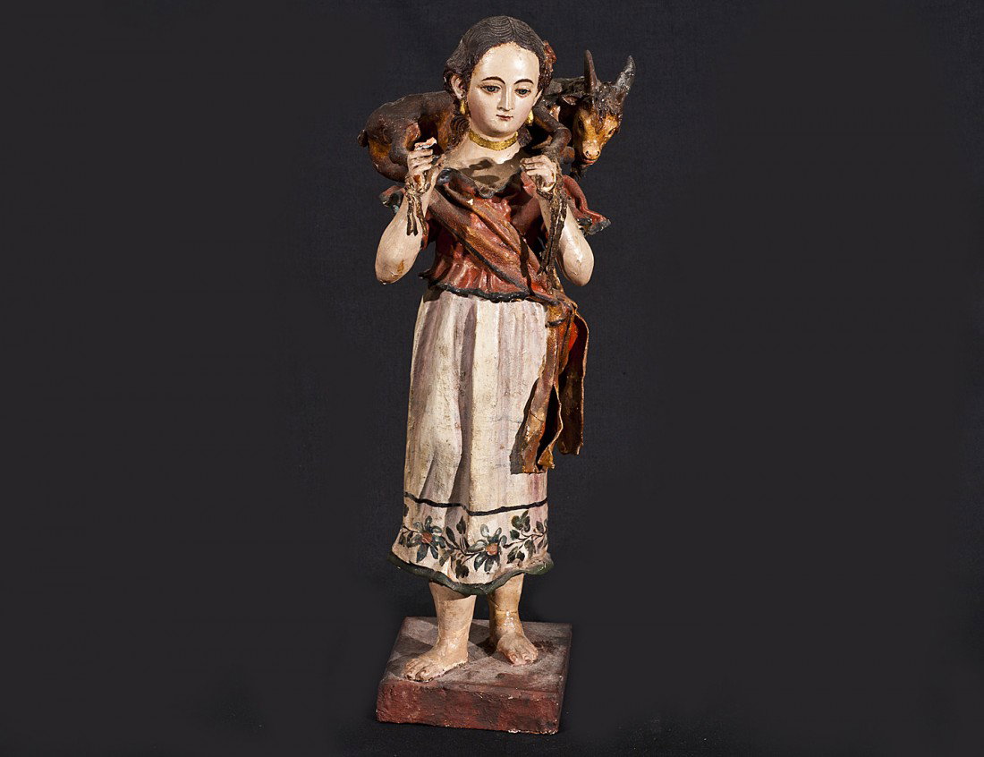 POLYCHROMED PAPIER MACHE KORESH FIGURE: Italian. 18th/19th Century. Of a maiden carrying a goat on her back. Height 17 1/2". (Cond: restoration, losses) (500/700)