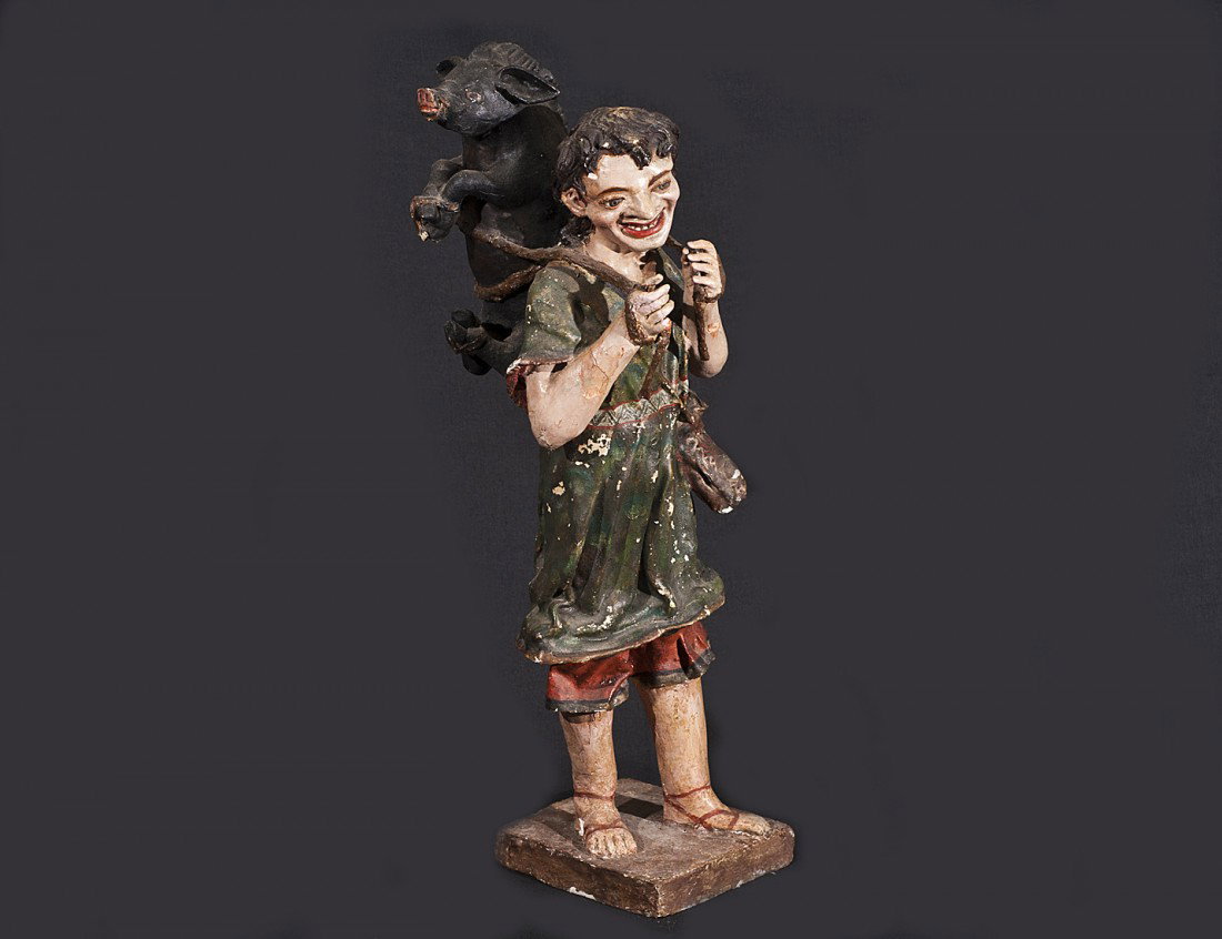 POLYCHROMED PAPIER MACHE KORESH FIGURE: Italian. 18th/19th Century. Of a peasant male carrying a pig on his back. Height 18 3/4". (Cond: restoration, losses) (500/700)